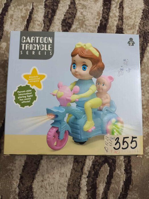 Іграшка велосипед з лялькою .