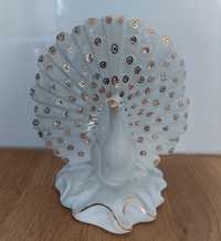 Figura decorativa em forma de pavão