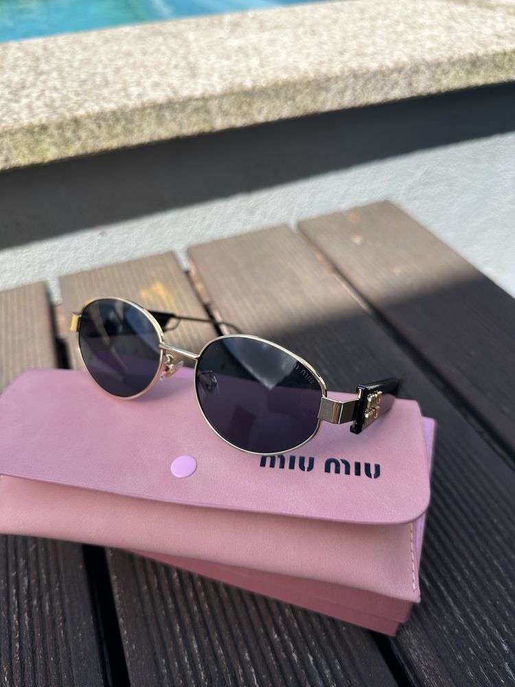 oculos miumiu novos ainda em caixa