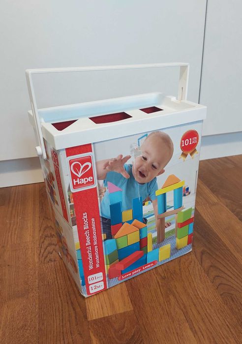 Drewniane klocki edukacyjne Hape i Cubika, kolorowe, 131 el.