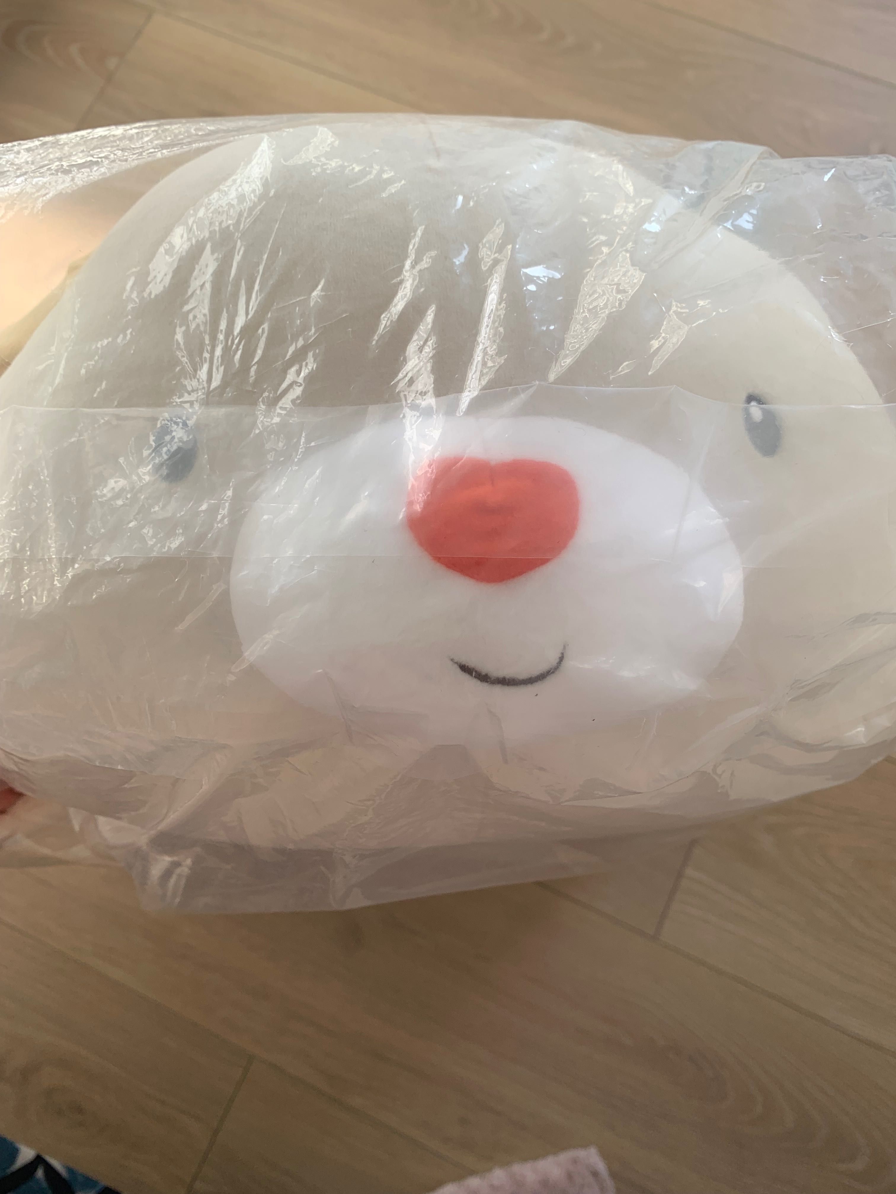 Peluche novo dentro do plástico selado