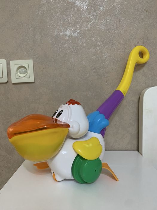 Іграшка Каталка пелікан  kiddieland Украінська