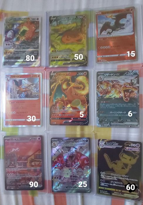 Cartas pokemon do charizard e mew
