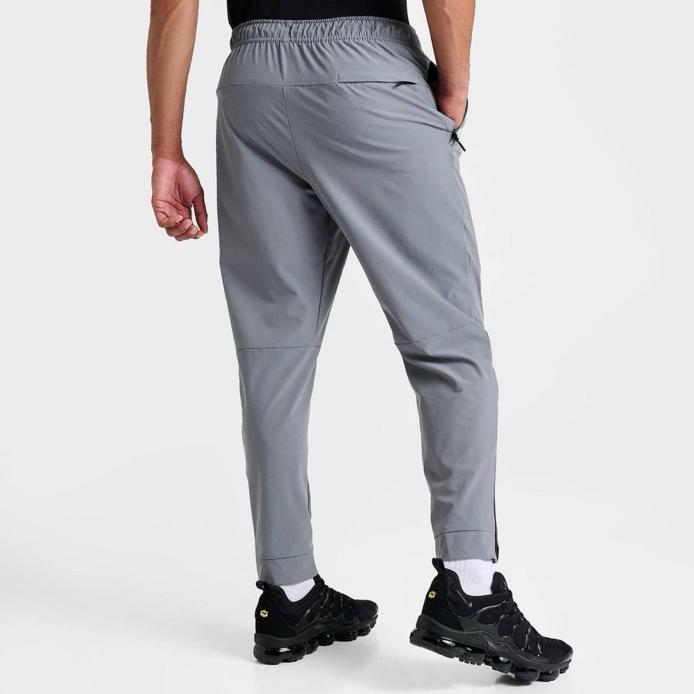 NIKE Dri-Fit Unlimited Tapered Leg tech fleece штани