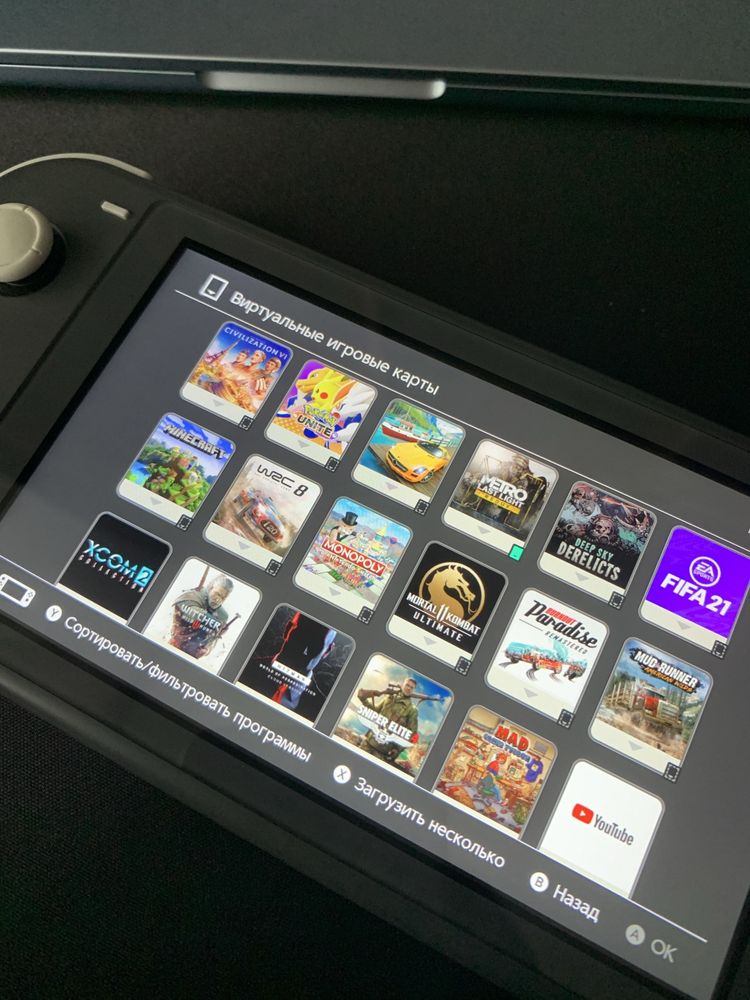 Nintendo Switch Lite + карта 128 gb, купа ігор, кейс