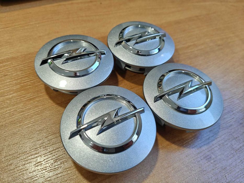 Oryginał dekielki dekle zaślepki kołpaczki Opel 13276.166 srebrne