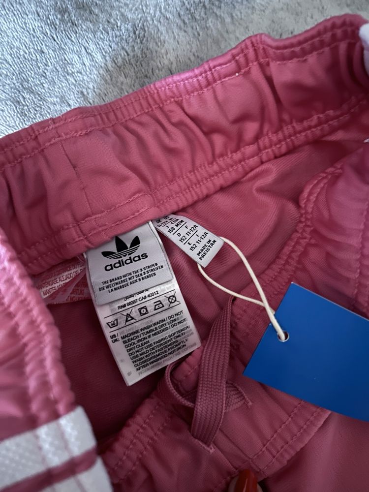 Нові штани adidas рожеві