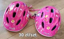 dwa kaski rowerowe