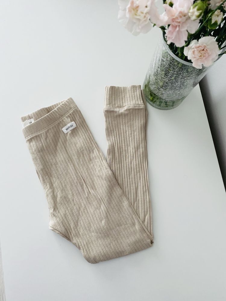 Nowe beżowe legginsy w prążki Newbie getry beż