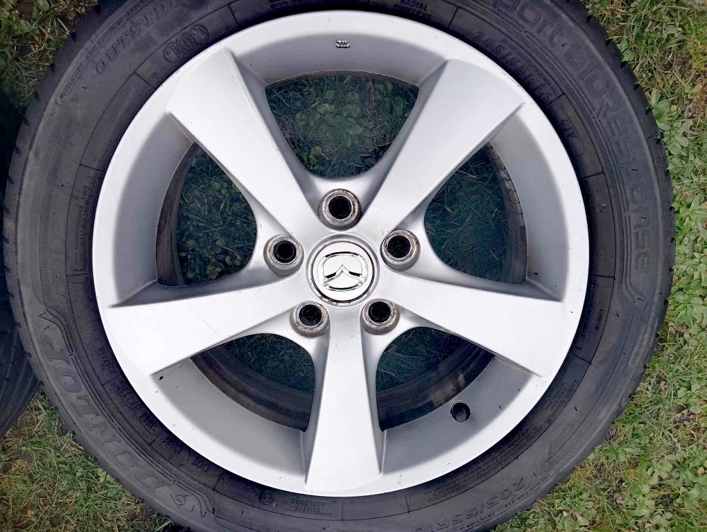Oryginalne felgi aluminiowe mazda 16" z 2 letnimi oponami DUNLOP