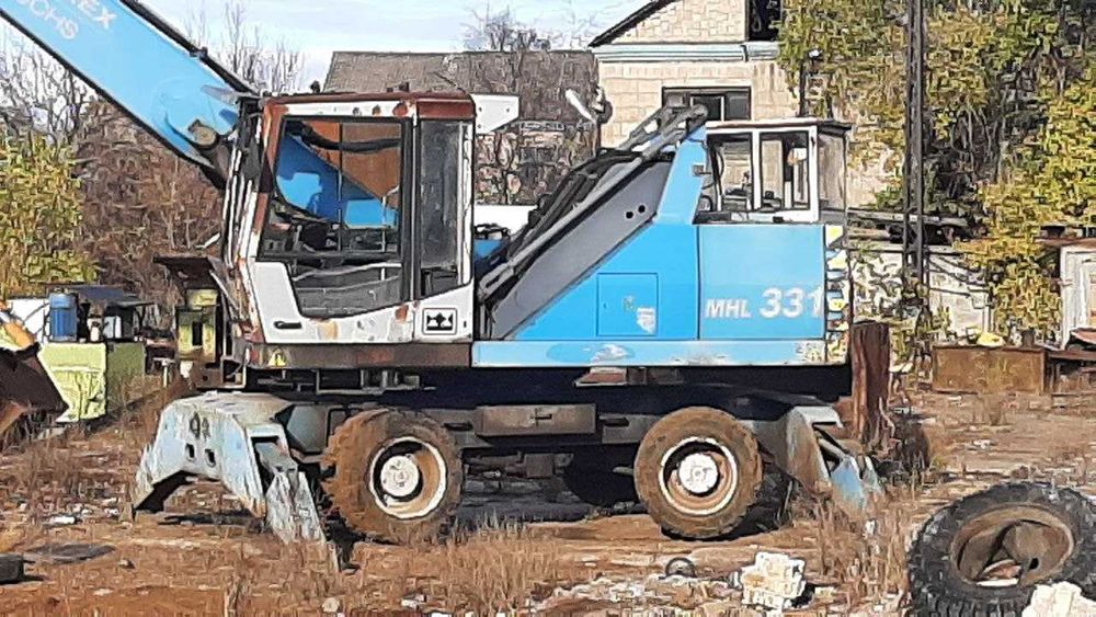 Продаж б/у екскаватора-навантажувача FUCHS