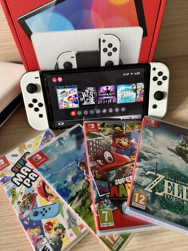 Nintendo Switch OLED biały + 4 gry na kartridżach + etui. Stan idealny