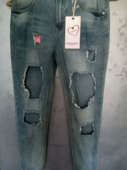 Джинсы рваные новые