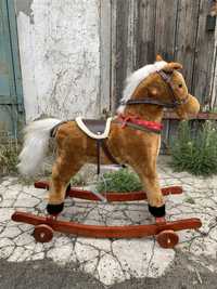 Дитяча гойдалка кінь з колесами