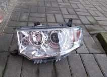 MITSUBISHI PAJERO SPORT L200 SOCZEWKA H7 LEWA PRZEDNIA LAMPA ORYGINAŁ