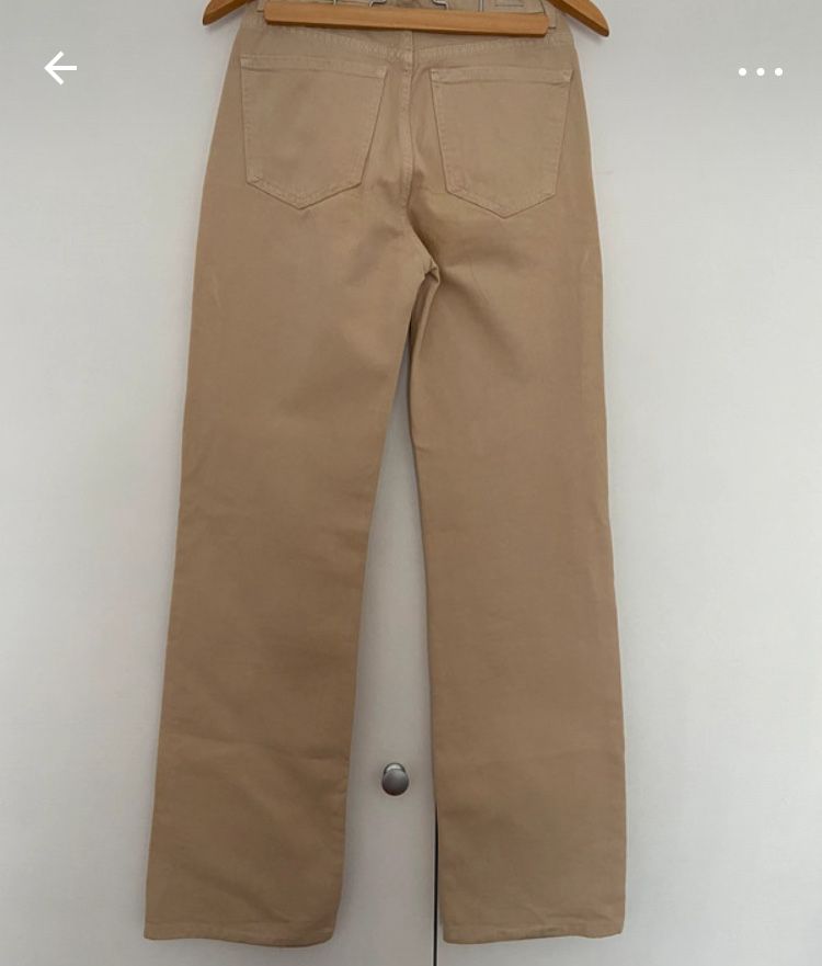 Calças bege com bolsos laterais da Pull