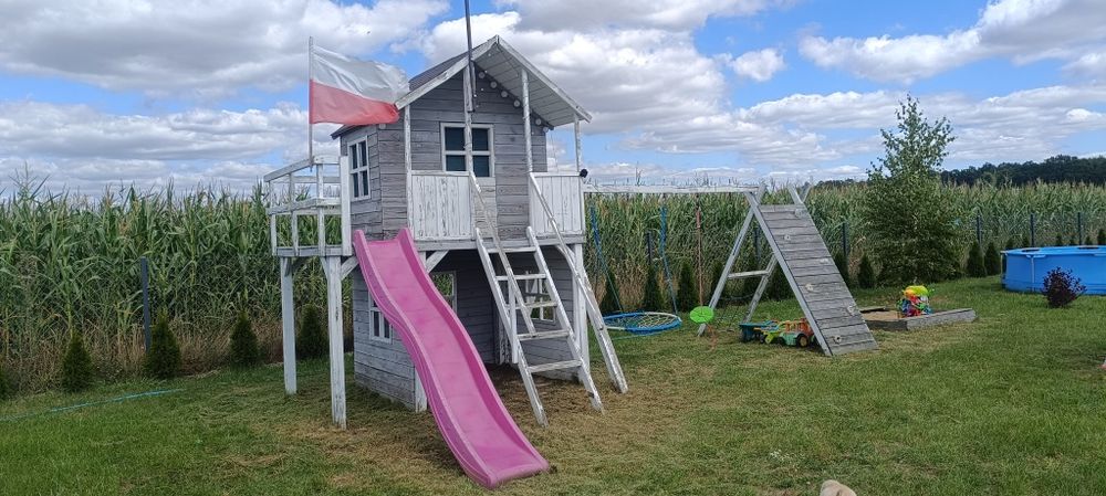 Duży plac zabaw domek dla dzieci huśtawka bocianie gniazdo zjeżdżalnia