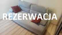 Sofa rozkładana z pojemnikiem na pościel