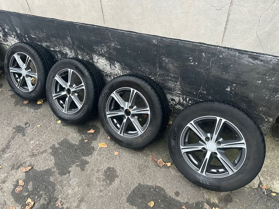 Продам колеса титаны с резиной R14 185/65 4*100