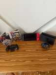 Konsola Nintendo Switch V2 + 2 Gry + Akcesoria - ZESTAW
