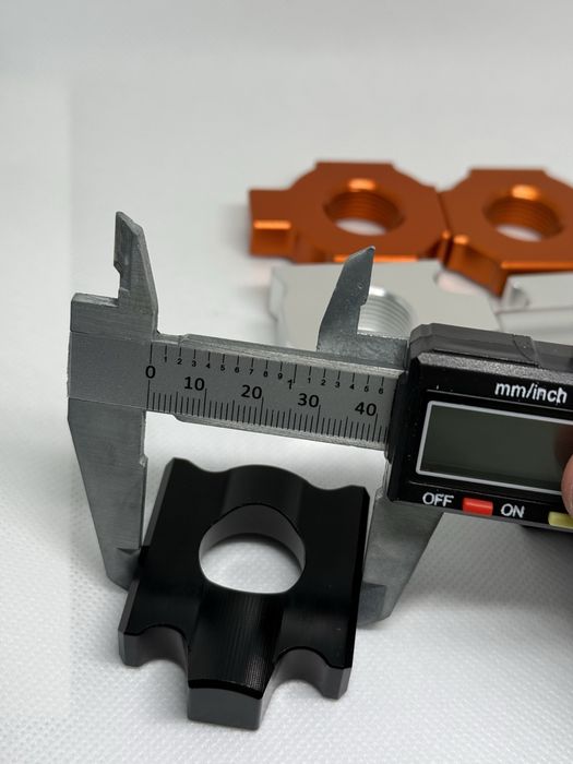 Блок регулювання натяжника для ланцюга