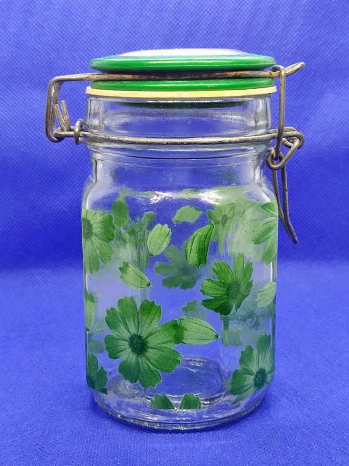 Frasco em vidro com tampa e floreados estampados