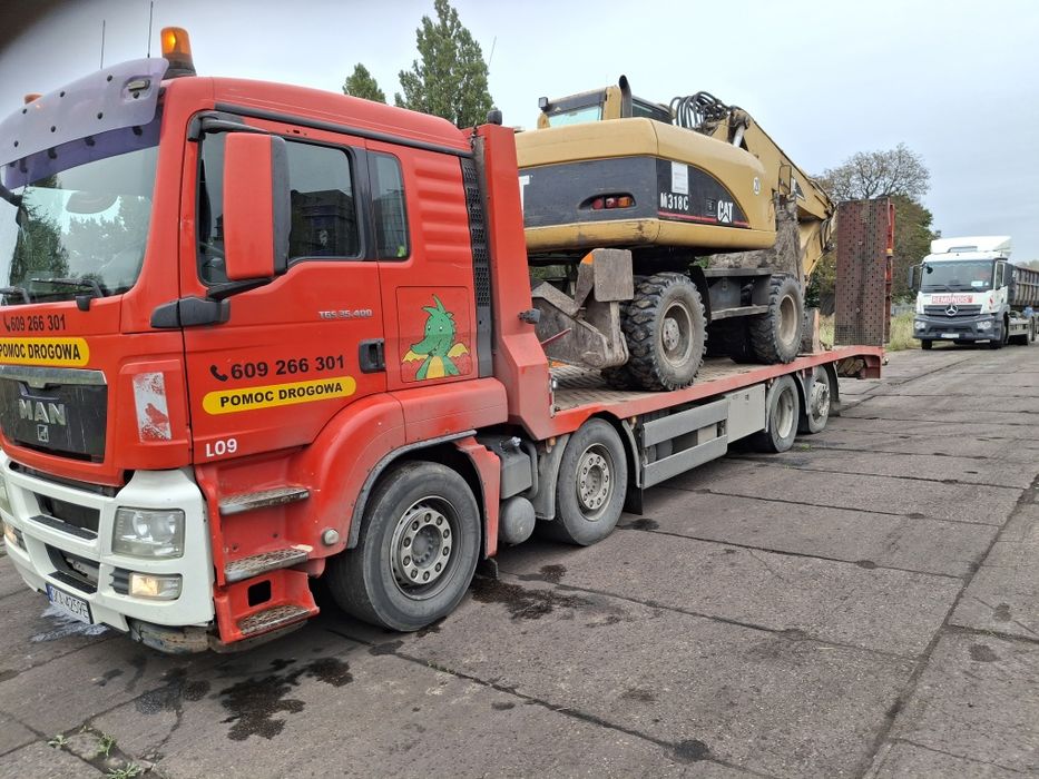 Laweta transport pomoc drogowa koparka ładowarka wozek widłowy bus
