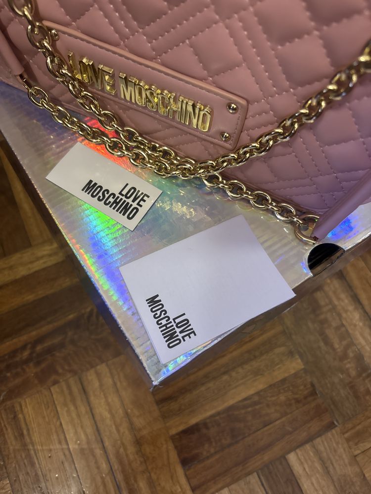 Mala rosa Guess tiracolo e ombro