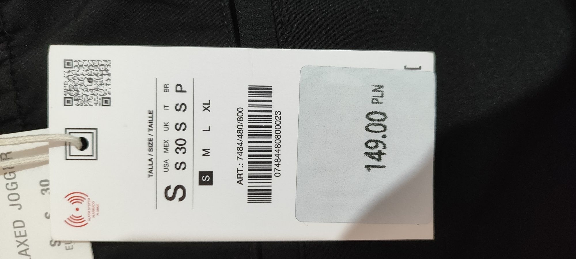 Spodnie relaxed fit z kontrastowymi paskami