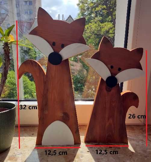 Para drewnianych lisów.