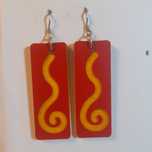 Wooden earrings in the shape of spirals.