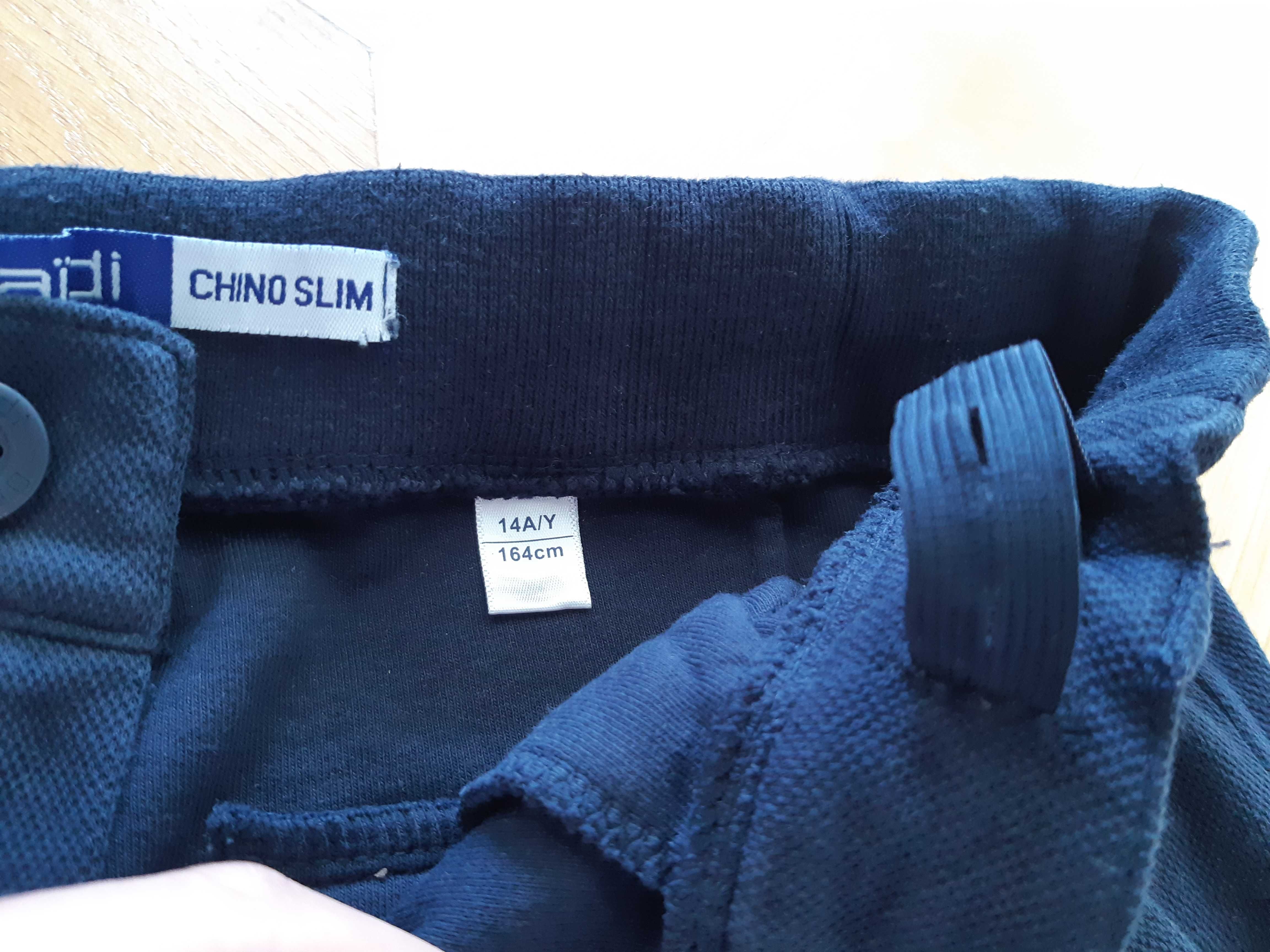 J. nowe spodnie chinos slim dres Okaidi 14/164 chłopięce granatowe