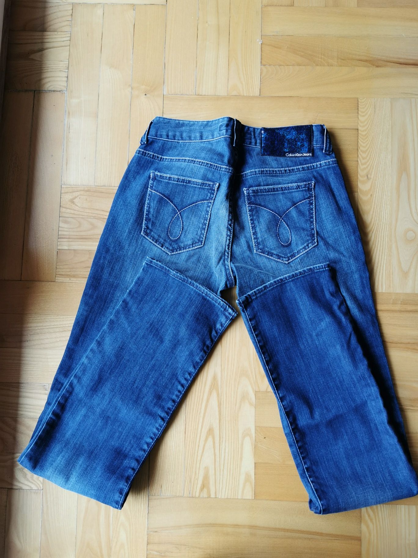 Damskie jeansy Calvin Klein spodnie jeansowe proste W27 s 36