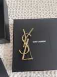 Broszka Saint Laurent - złota broszka z logo linii Ives Saint Laurent
