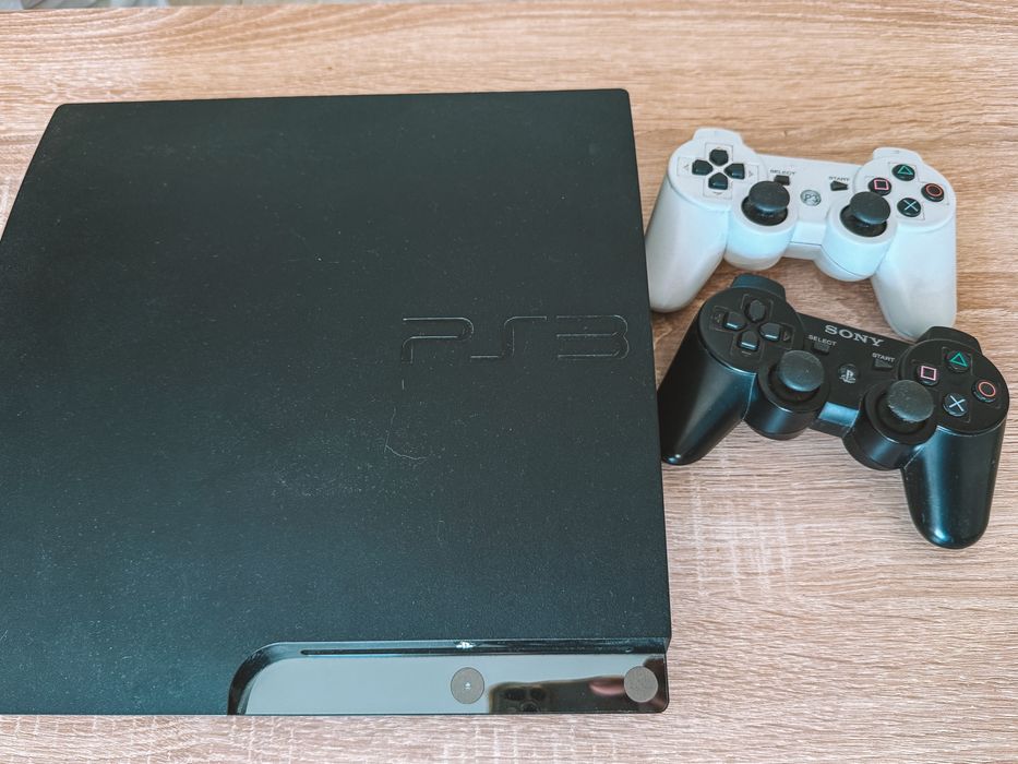 Playstation 3 Slim + 2 comandos + Jogos