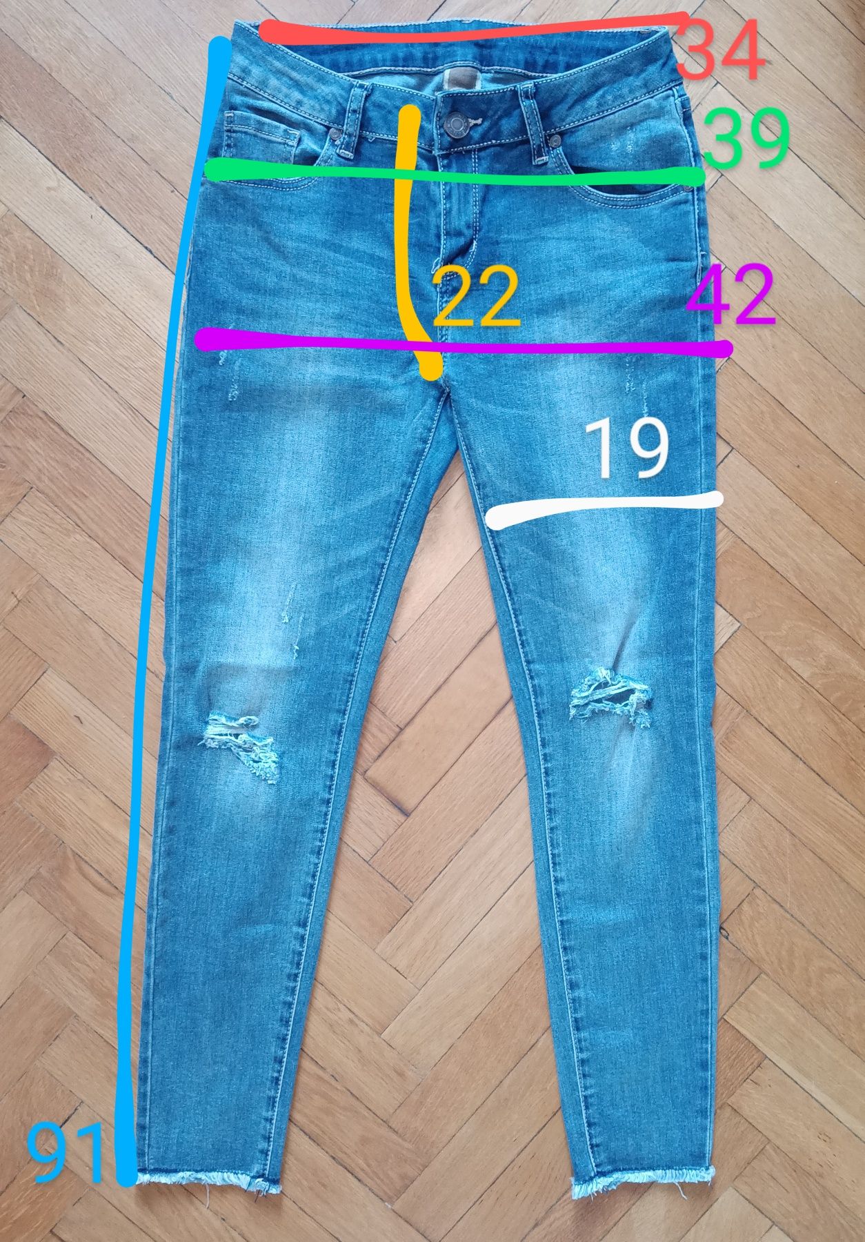 Niebieskie jeansy z przetarciami m/l Fashion Jeans