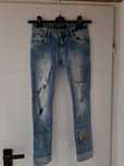 Spodnie jeansowe z przetarciami philipp plein