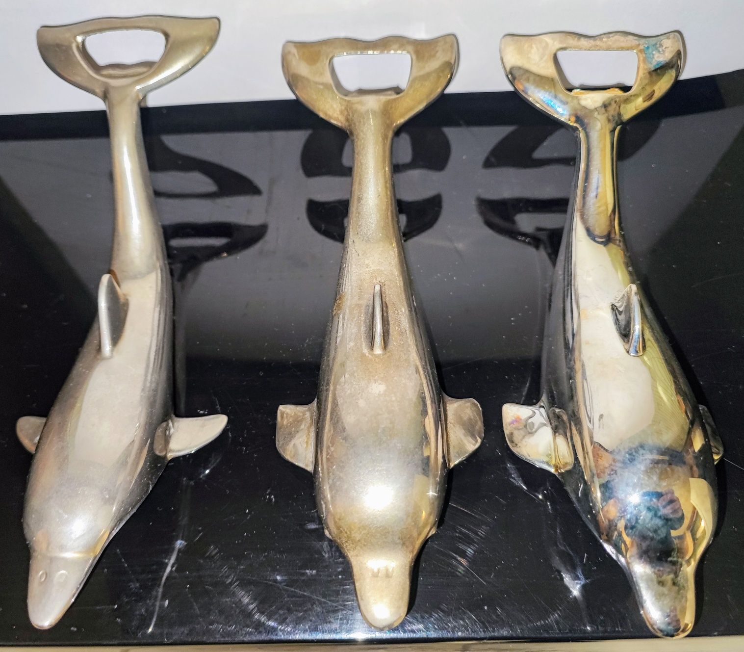 Metalowe otwieracze "delfin"