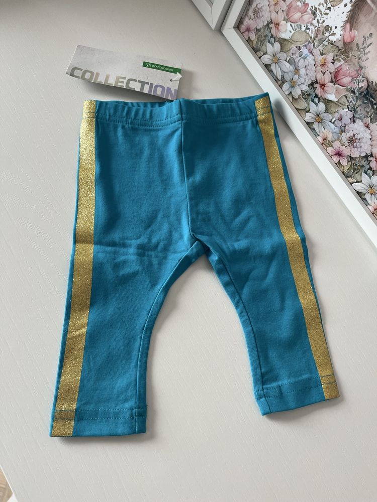 Nowe z metkami niebieskie legginsy ze złotym lampasem Coccodrillo 62