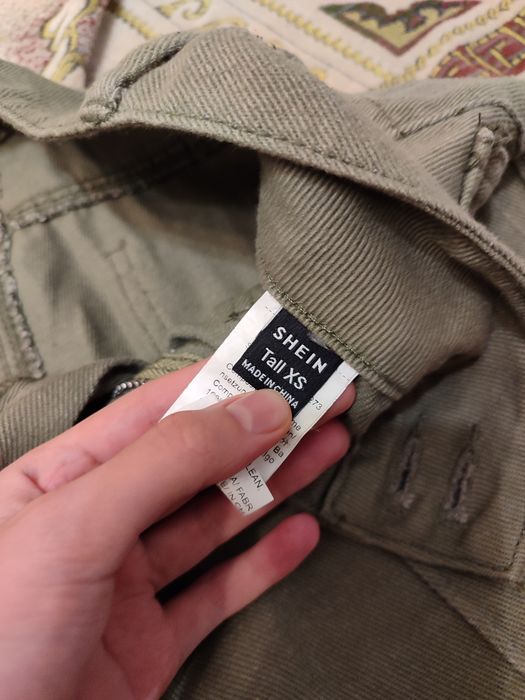 Оливкові клеш штани