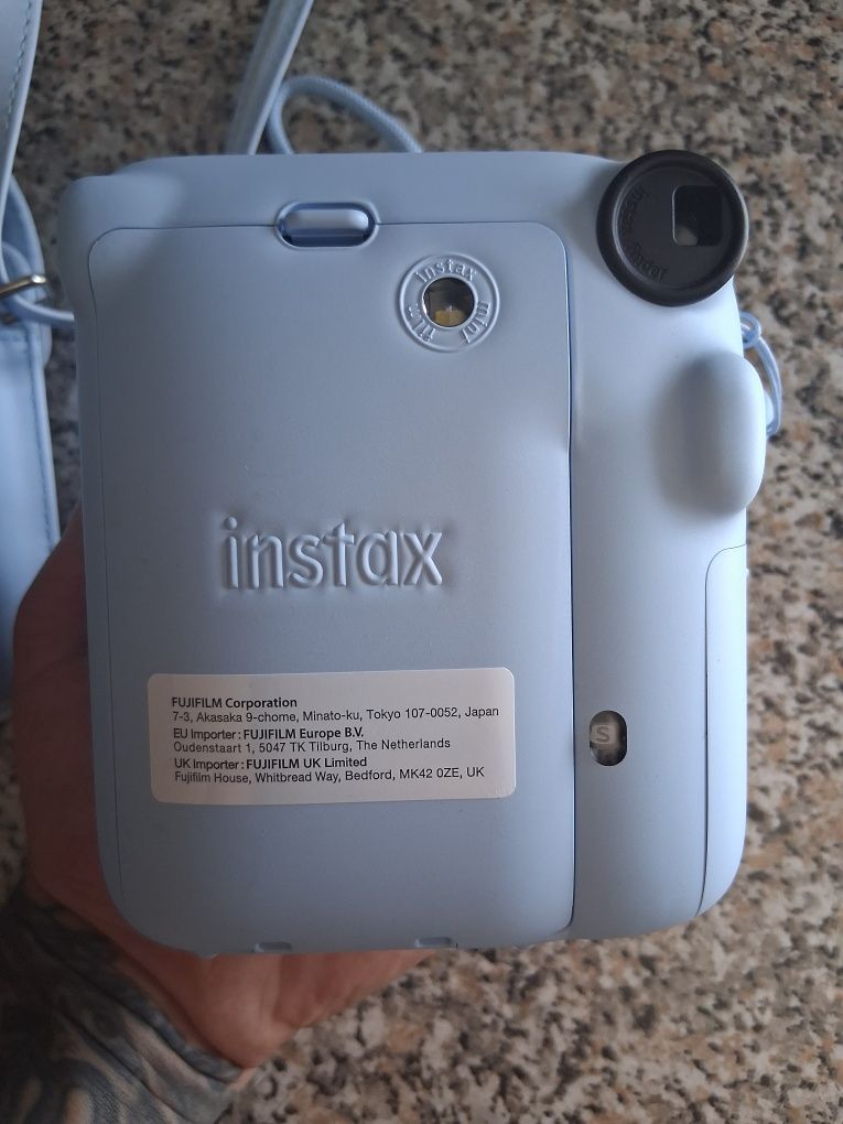 Máquina fotográfica instantânea