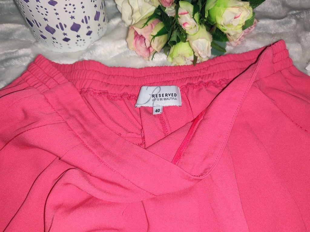 Różowe spodnie z mankietem Reserved rozmiar z metki 40