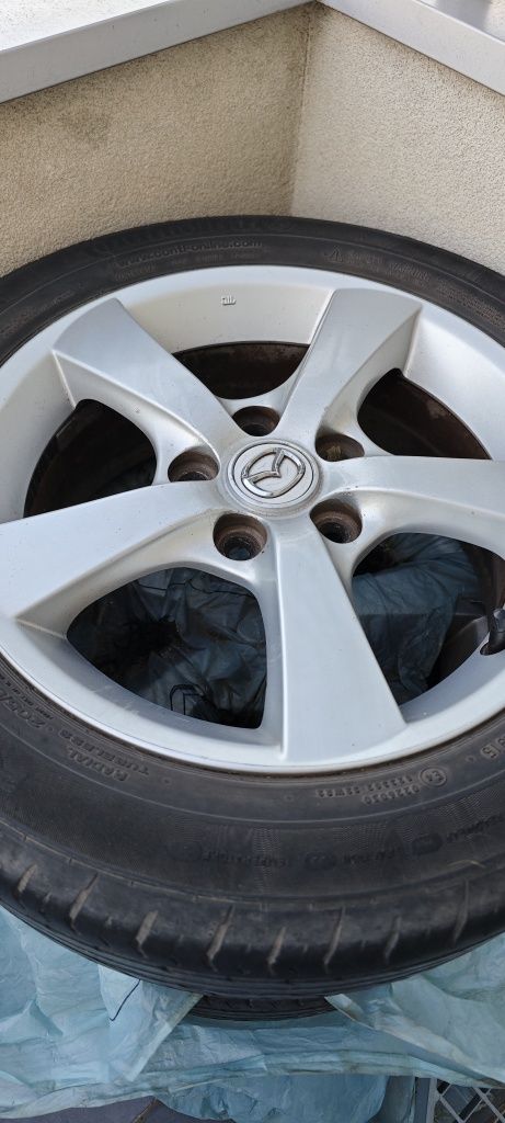 Komplet 4 oryginalnych alufelg 16" do Mazda 3 z oponami Continental