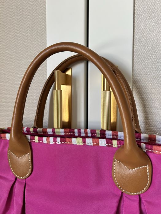 Mala de mão fúcsia