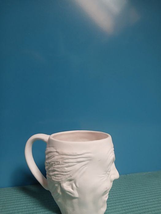 Kubek z motywem twarzy jokera