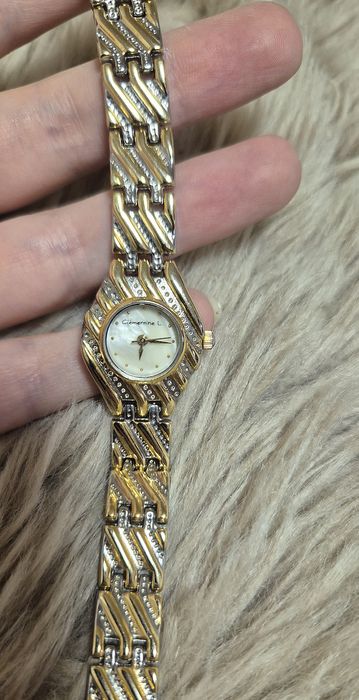 Вінтажний годинник з перламутровим циферблатом