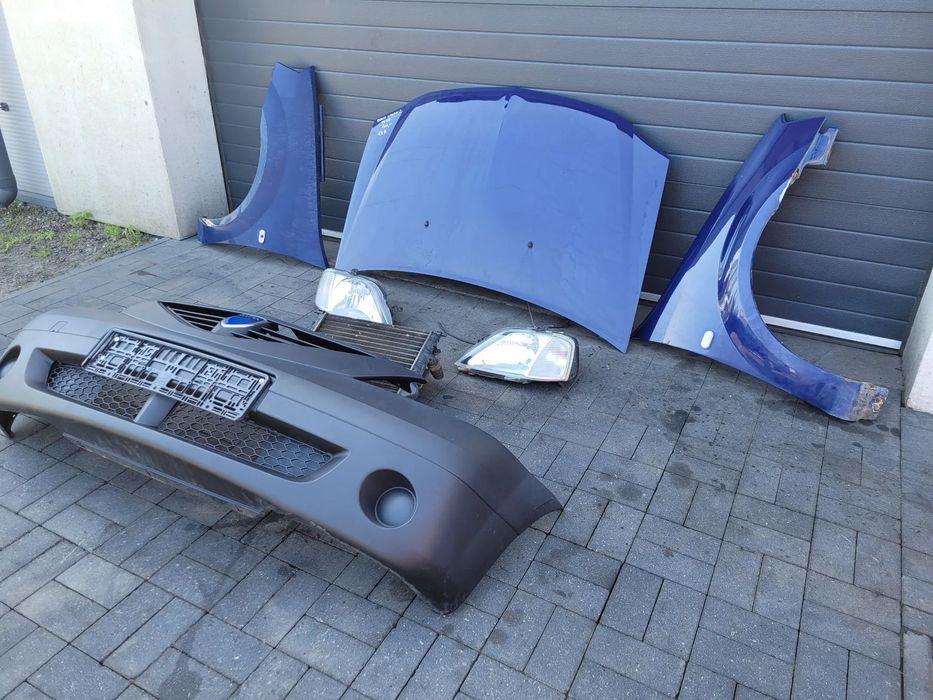 Dacia Logan I 04-08 1.4 Zestaw maska lampy blotniki chlodnica zderzak
