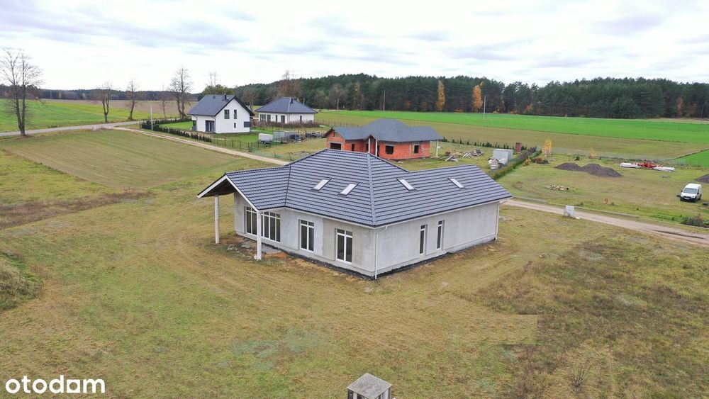 Atrakcyjna działka z nowym domem jednorodzinnym