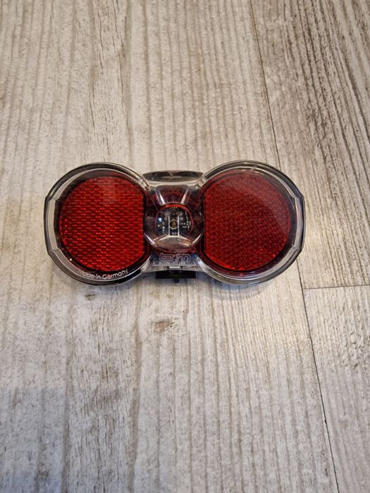 Lampka lampa rowerowa tylna na bagażnik BM Toplight Flat Plus przewód