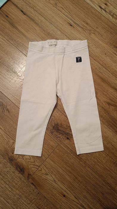 Białe legginsy spodnie 98